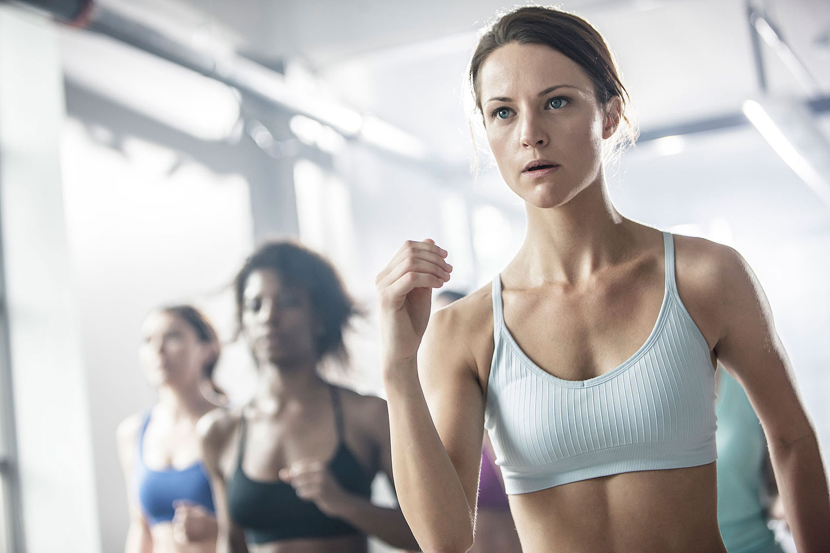Multiple women in a yoga class. | John Fedele Lifestyle Photography