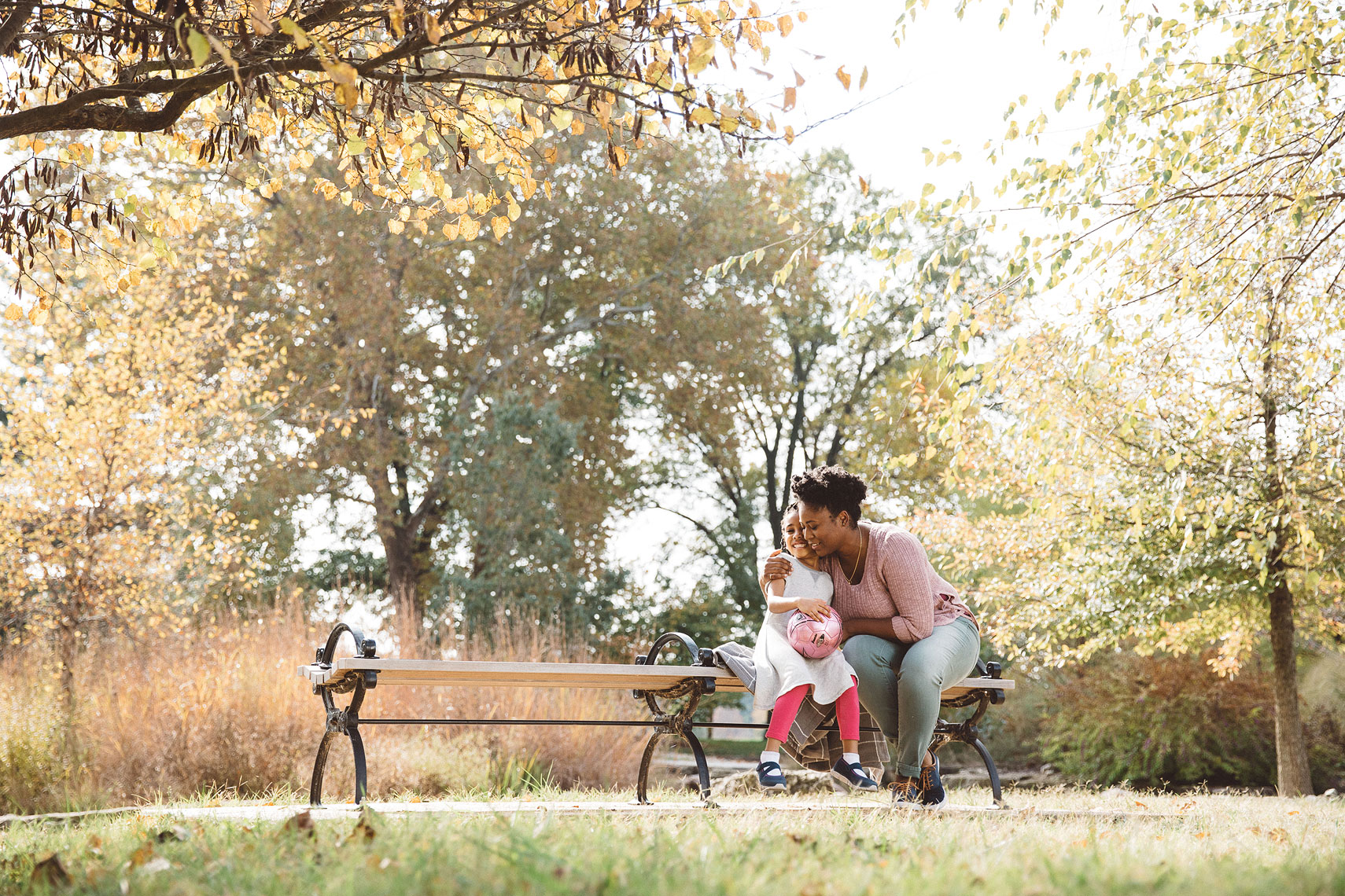 Mother and daughter hugging on a bench |   Centene | John Fedele Lifestyle Photography