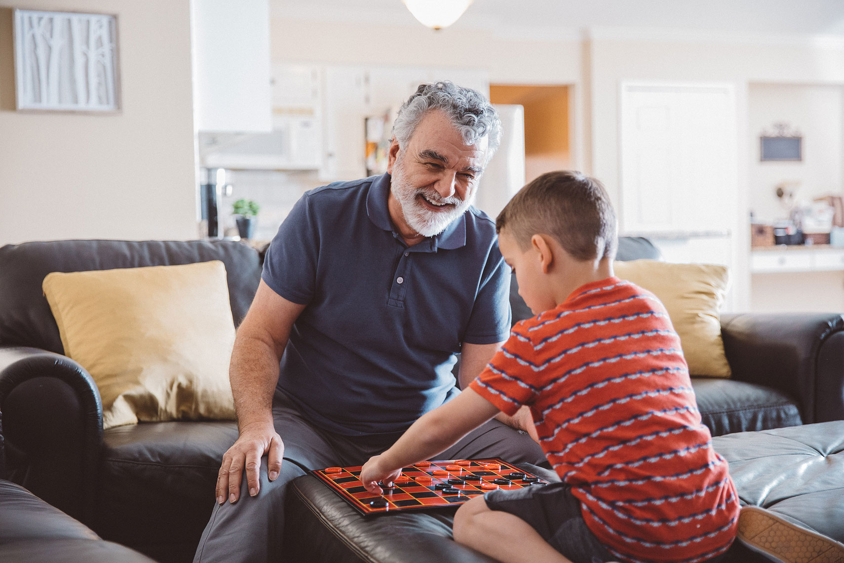 Grandfather and Grandson playing checkers |  Centene | John Fedele Lifestyle Photography