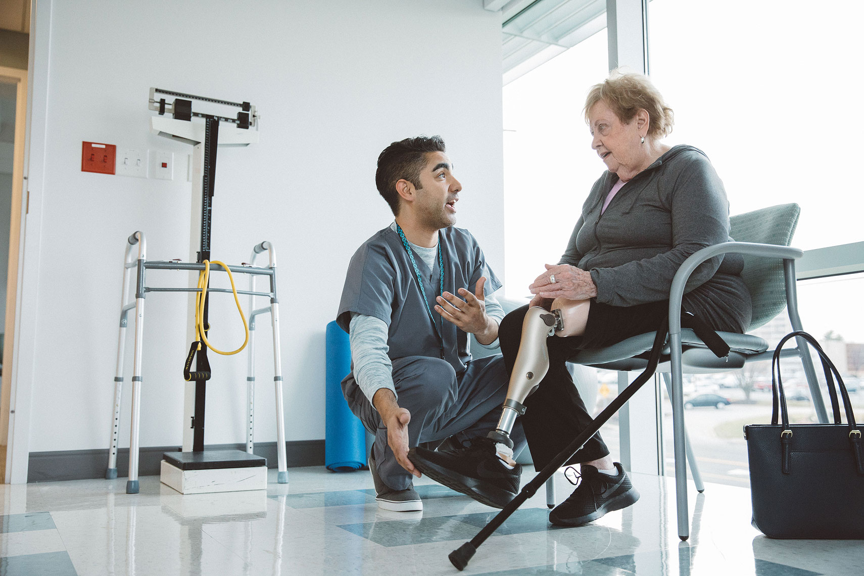Women discussing her prothetic leg with a nurse |  Centene | John Fedele Lifestyle Photography