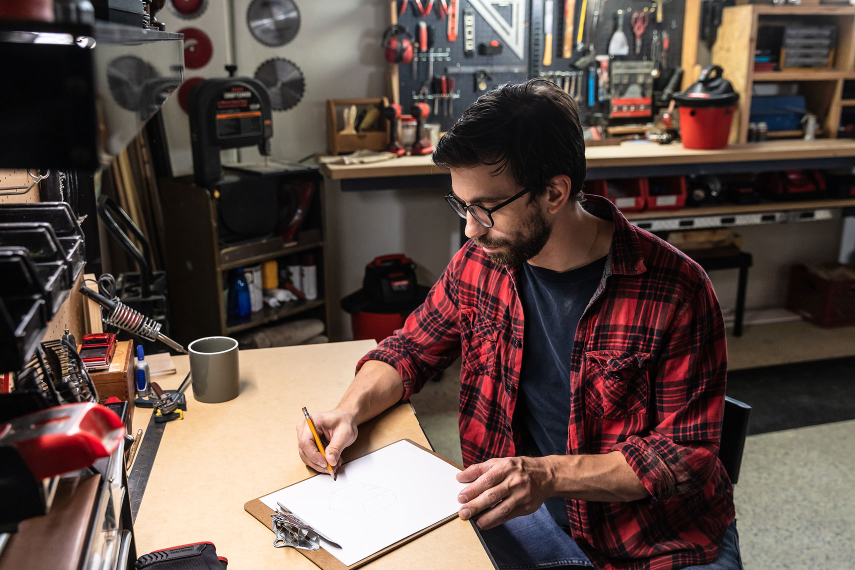 Craftsman Tools 9 Gallon Wet/Dry Vacuum | Man sitting at his work bench in a workshop | John Fedele Product Photography
