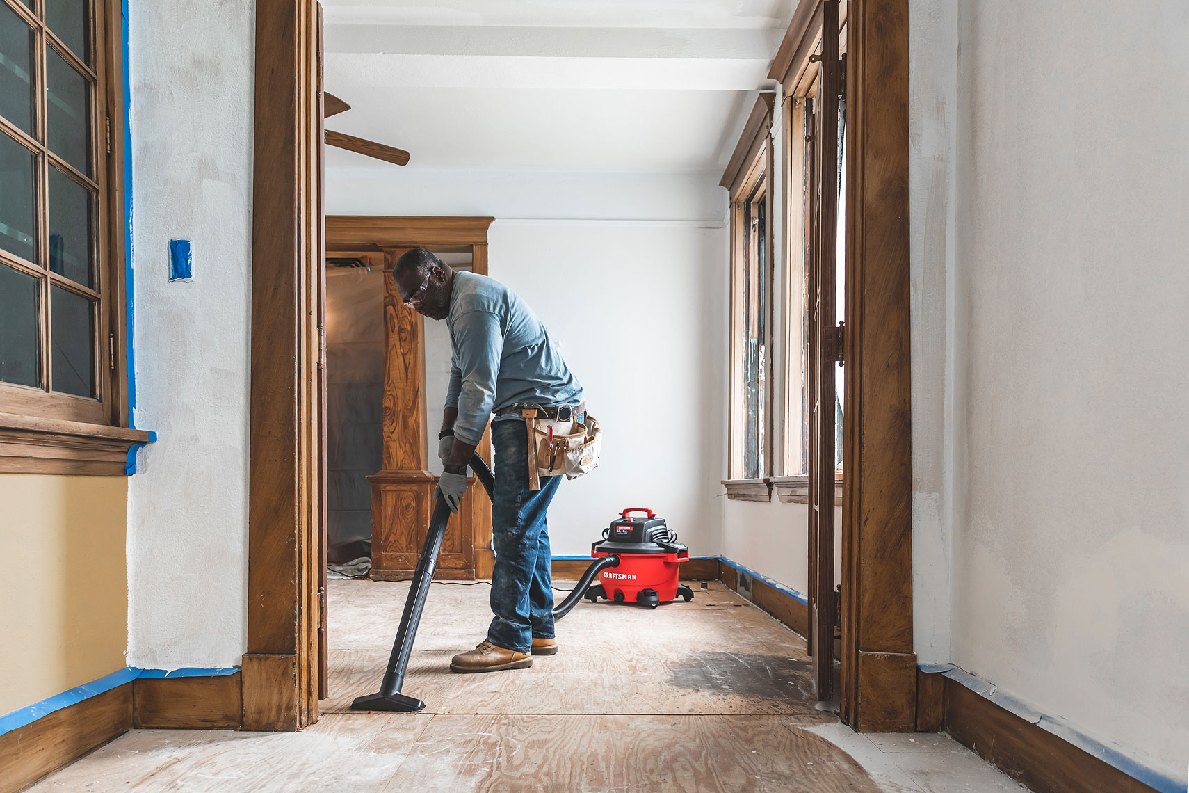 Craftsman Tools 12 Gallon Wet/Dry Vacuum | Man vacuuming in a room remodel | John Fedele Product Photography