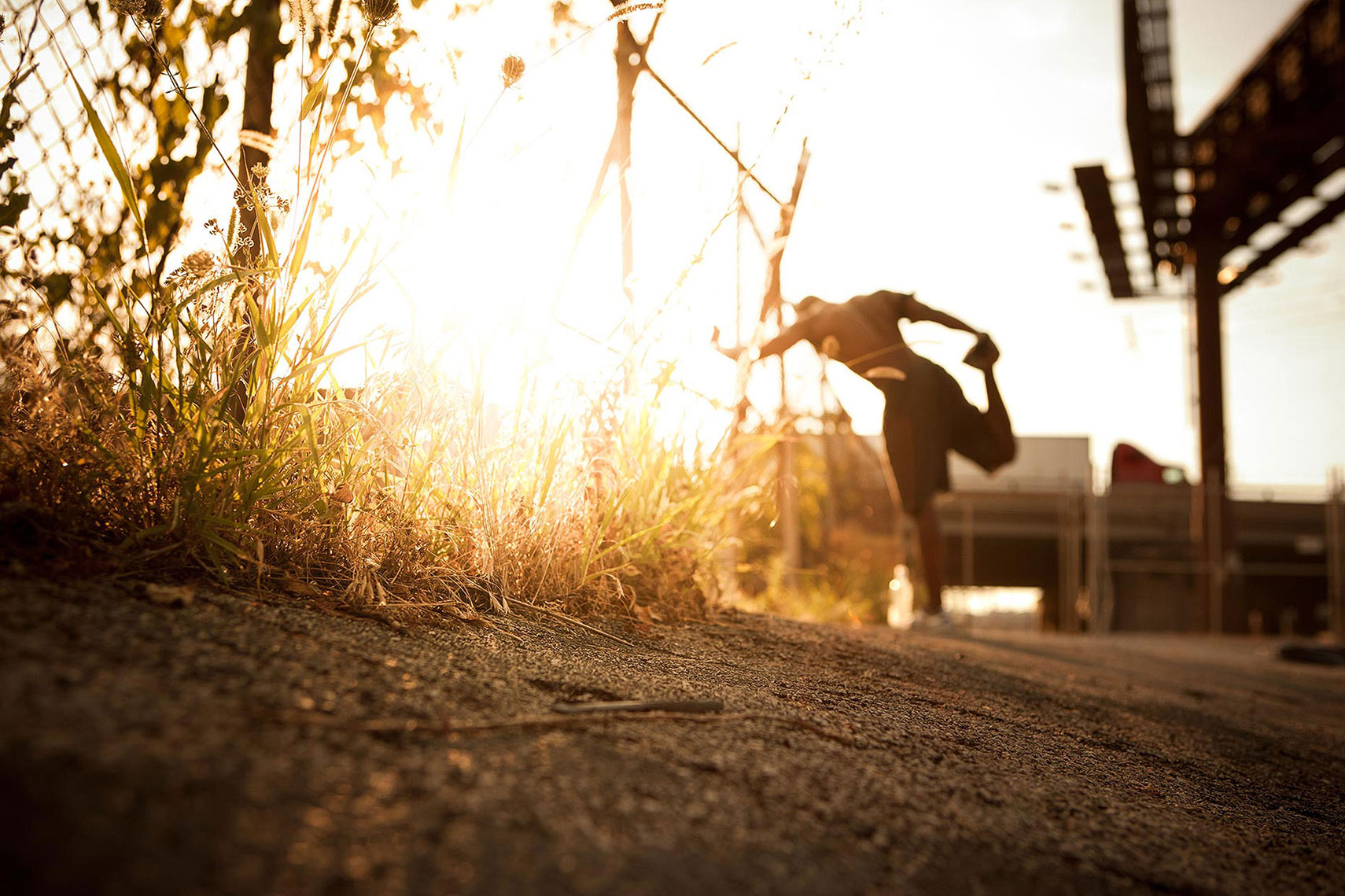 A man stretching before a run at sunset. | John Fedele Lifestyle Photography