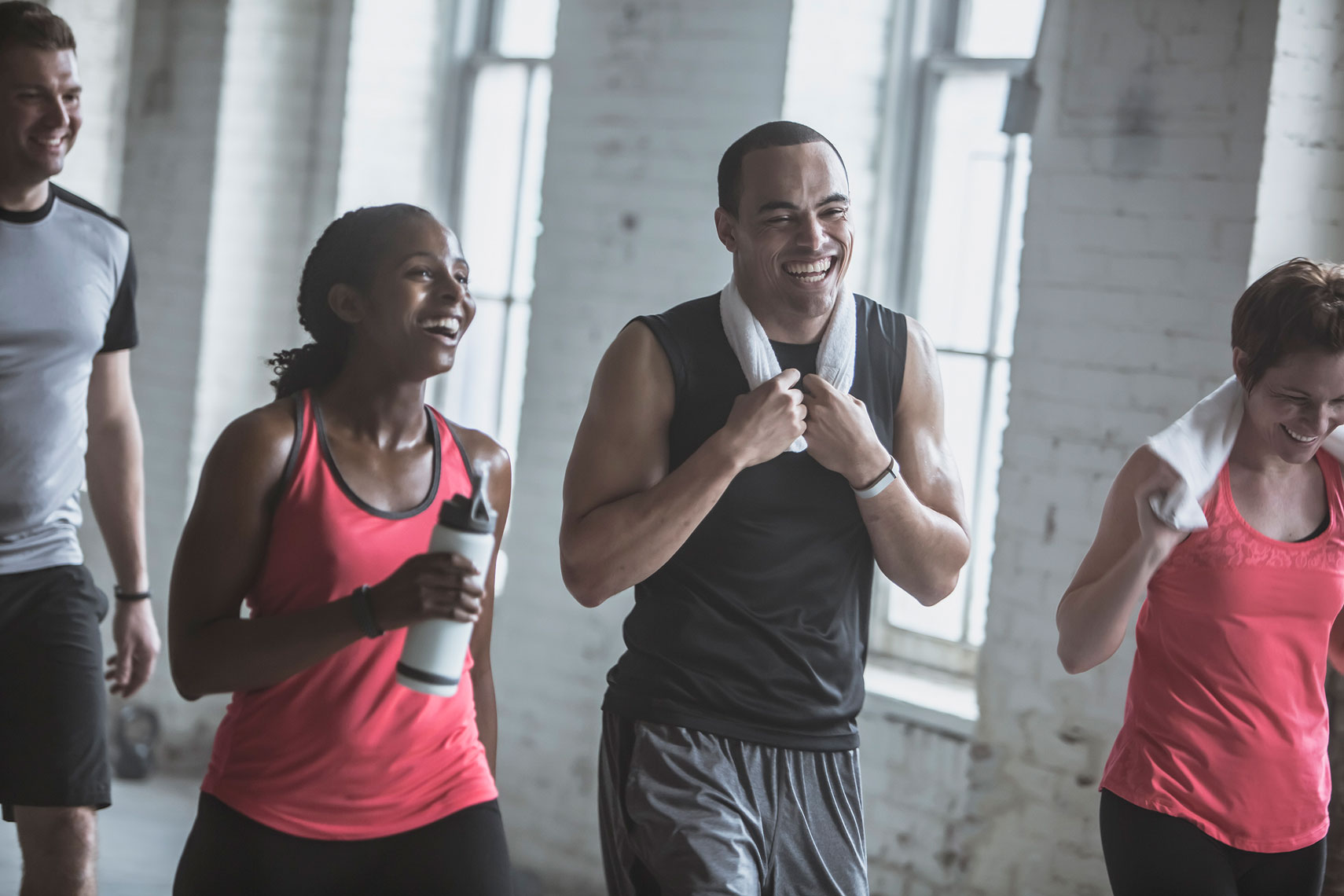Friends laughing after finishing a work out. | John Fedele Lifestyle Photography