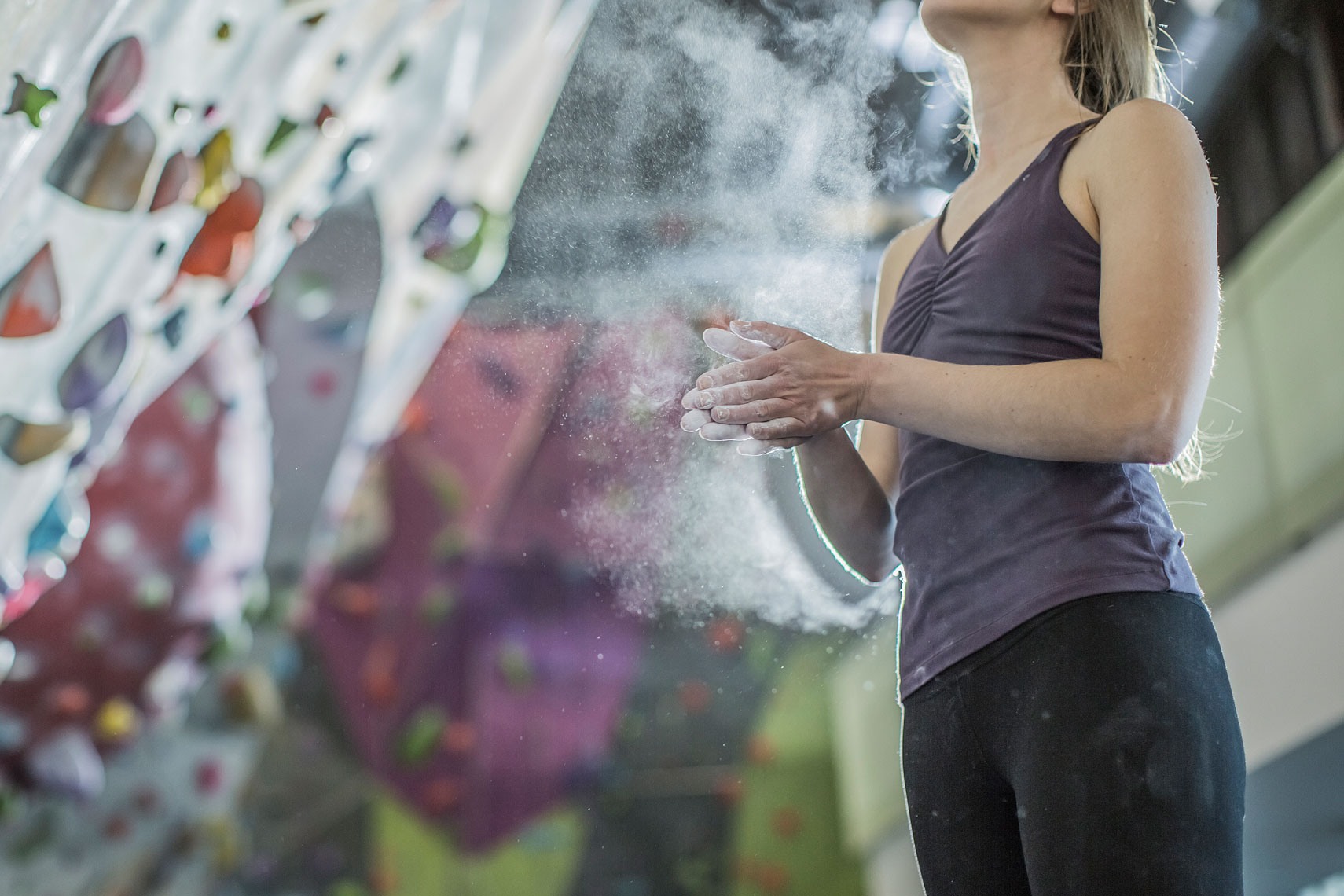 Close up of a woman chalking her hands getting ready to climb. | John Fedele Lifestyle Photography