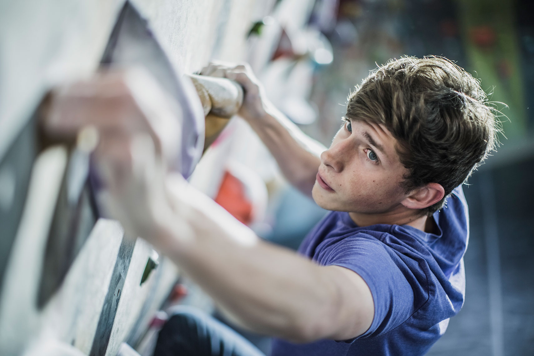 Man climbing at a climbing gym. | John Fedele Lifestyle Photography
