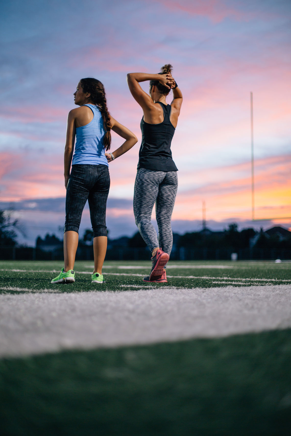 Two woman standing on a track. | John Fedele Lifestyle Photography